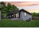 View of the backyard and screened in patio at dusk at 400 W Washington St, Minneola, FL 34715