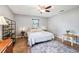 Bright bedroom with natural light and a ceiling fan at 400 W Washington St, Minneola, FL 34715