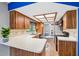 Kitchen boasts plenty of cabinet space, white countertops and stainless steel appliances at 400 W Washington St, Minneola, FL 34715