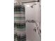 Shower stall with tile walls, tile accents, and a shower curtain at 4634 Bigler Ln, Mount Dora, FL 32757