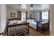 Bedroom with wood floors, two queen beds, and two windows at 4634 Bigler Ln, Mount Dora, FL 32757