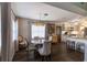 Bright dining area with modern chandelier and elegant furnishings adjacent to the kitchen at 4634 Bigler Ln, Mount Dora, FL 32757