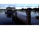 A person looking out from a dock over a tranquil body of water at 4634 Bigler Ln, Mount Dora, FL 32757