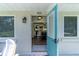 Welcoming front entry with an open doorway leading into the home's interior at 4634 Bigler Ln, Mount Dora, FL 32757