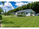 Lovely home featuring a green lawn, well-maintained landscaping, and a cozy neighborhood setting at 4634 Bigler Ln, Mount Dora, FL 32757
