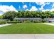 Charming home showcasing lush green lawns and colorful landscaping for a picturesque street view at 4634 Bigler Ln, Mount Dora, FL 32757