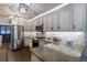 Bright kitchen with granite countertops, stainless steel appliances, and ample cabinet space at 4634 Bigler Ln, Mount Dora, FL 32757