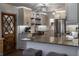 Well-lit kitchen featuring granite countertops, stainless steel appliances, and stylish tiled backsplash at 4634 Bigler Ln, Mount Dora, FL 32757