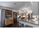 Modern kitchen design with granite countertops, stainless steel appliances, and stylish lighting at 4634 Bigler Ln, Mount Dora, FL 32757