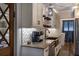 Updated kitchen with granite countertops, stainless steel appliances, and open access to other areas at 4634 Bigler Ln, Mount Dora, FL 32757