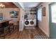 Bright Laundry Room with stacked washer and dryer, and plenty of natural light at 4634 Bigler Ln, Mount Dora, FL 32757