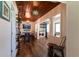 Inviting living room with wood floors, wooden ceiling and adjacent laundry area at 4634 Bigler Ln, Mount Dora, FL 32757
