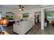 Comfortable living room with stylish decor and a view into the kitchen and other parts of the home at 4634 Bigler Ln, Mount Dora, FL 32757