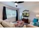 Cozy living room with comfortable seating, modern decor, and a large window at 4634 Bigler Ln, Mount Dora, FL 32757