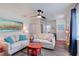 Comfortable living room with neutral-toned sofas, pops of color, and a ceiling fan at 4634 Bigler Ln, Mount Dora, FL 32757