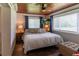 Comfortable main bedroom with natural light, wood ceiling, lamps, and a sitting area at 4634 Bigler Ln, Mount Dora, FL 32757