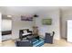 Cozy recreation room with comfortable seating, television, and access to an adjacent area at 4634 Bigler Ln, Mount Dora, FL 32757