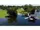 Picturesque waterfront view showcasing a private dock, gazebo, and tranquil lake, creating an idyllic retreat at 4634 Bigler Ln, Mount Dora, FL 32757