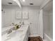 Elegant bathroom with double vanity, marble countertop, and tub shower combo at 500 Lake Forest Cir, Mount Dora, FL 32757