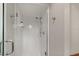 Modern bathroom features white tile shower with glass door and chrome fixtures at 500 Lake Forest Cir, Mount Dora, FL 32757