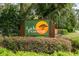Attractive Lake Forest neighborhood sign, enhanced by colorful landscaping and lush greenery at 500 Lake Forest Cir, Mount Dora, FL 32757