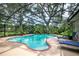 Enjoy the beautiful enclosed pool with a screened enclosure, patio, and well-maintained landscaping at 500 Lake Forest Cir, Mount Dora, FL 32757