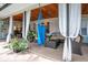 Inviting screened porch offering a relaxing atmosphere with comfortable furniture and serene backyard views at 500 Lake Forest Cir, Mount Dora, FL 32757