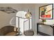 Welcoming entryway adorned with a floral wreath, stylish decor, and a cozy chair at 5046 Harbour Dr, Oxford, FL 34484
