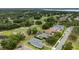 Aerial view of the property highlighting the home's location near the golf course and surrounding community at 5090 Greens Dr, Lady Lake, FL 32159
