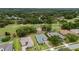 Aerial view of the property highlighting the home's location within the community and golf course at 5090 Greens Dr, Lady Lake, FL 32159