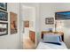 Charming bedroom with an ensuite bathroom, decorated with travel-themed artwork at 5090 Greens Dr, Lady Lake, FL 32159