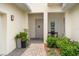 Inviting front porch with stone walkway, plants, and a bench at 5090 Greens Dr, Lady Lake, FL 32159