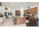 Bright, modern kitchen with two-tone cabinets, stainless steel appliances, and a large center island with bar seating at 5090 Greens Dr, Lady Lake, FL 32159