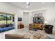 Spacious living room with a view of the outdoor patio through sliding glass doors at 5090 Greens Dr, Lady Lake, FL 32159