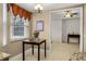 Cozy breakfast nook featuring a decorative table and bright window with charming window treatments at 52 Camino Real Blvd, Howey In The Hills, FL 34737