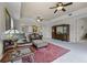 Inviting living room with ceiling fans, plush leather seating, and an open concept design at 52 Camino Real Blvd, Howey In The Hills, FL 34737