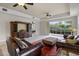 Spacious living room with a sliding glass doors, neutral walls and dark wood furniture at 52 Camino Real Blvd, Howey In The Hills, FL 34737