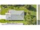 An aerial view showcases the roof's condition and the backyard's lawn at 5562 Charleston Avenue, Tavares, FL 32778