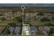 Aerial view of house in neighborhood shows street appeal and well-manicured lawns at 5562 Charleston Avenue, Tavares, FL 32778