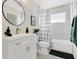 Cozy bathroom with white vanity, modern fixtures, and neutral walls at 5562 Charleston Avenue, Tavares, FL 32778