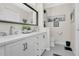 Bathroom featuring double sinks, a vanity, and neutral paint with tile floors at 5562 Charleston Avenue, Tavares, FL 32778