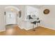Open-concept entryway featuring a breakfast bar overlooking the kitchen, with modern light fixtures at 5562 Charleston Avenue, Tavares, FL 32778