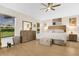 Spacious main bedroom features a ceiling fan and natural light from two large windows at 5562 Charleston Avenue, Tavares, FL 32778