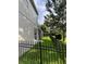 Fenced backyard with lush green grass, offering privacy and security for outdoor enjoyment at 633 Grand Cypress Pt, Sanford, FL 32771