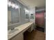 Bathroom featuring a shower, vanity and light blue walls at 633 Grand Cypress Pt, Sanford, FL 32771