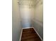 Empty closet with shelving and hardwood floors at 633 Grand Cypress Pt, Sanford, FL 32771