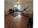 Bright exercise room with hardwood floors, ceiling fan, and workout equipment at 633 Grand Cypress Pt, Sanford, FL 32771