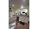 Updated kitchen featuring stainless steel appliances, granite counters, and a breakfast bar at 633 Grand Cypress Pt, Sanford, FL 32771