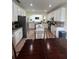 Open kitchen featuring white cabinets and an island at 633 Grand Cypress Pt, Sanford, FL 32771