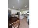 Open kitchen featuring white cabinets and an island at 633 Grand Cypress Pt, Sanford, FL 32771